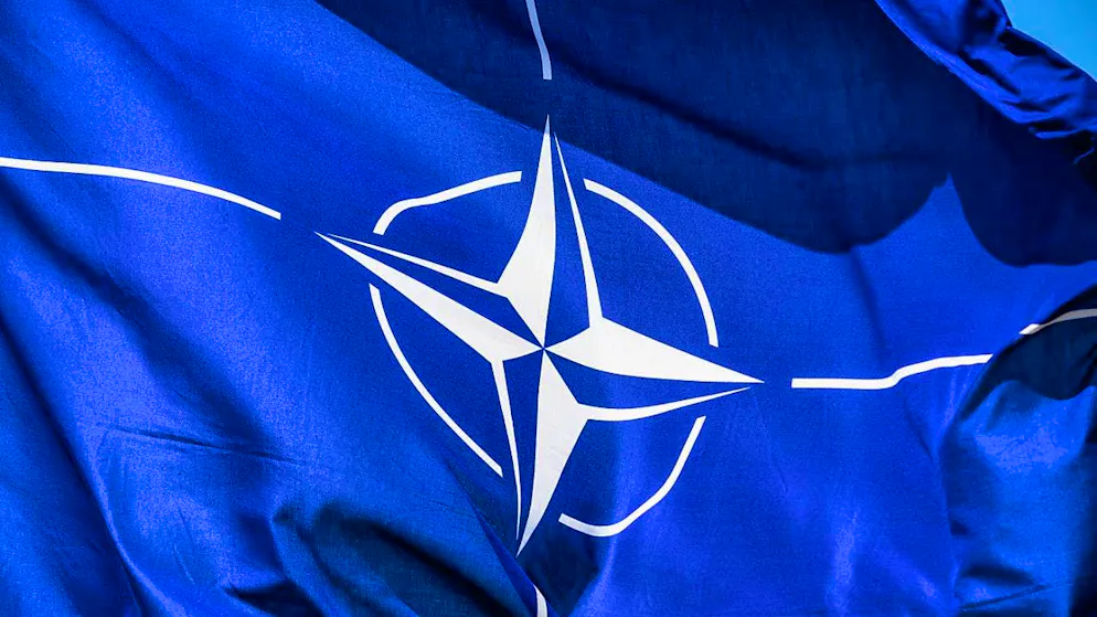 ARCHIVE - A NATO flag flies in the wind. Photo: Robert Michael/dpa