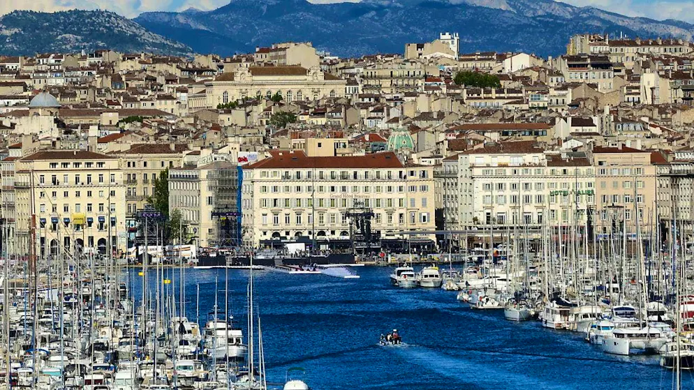 Eiffel Tower, Versailles, Tahiti - iconic sports venues - Gallery. Sailors compete for medals in front of the port of Marseille.