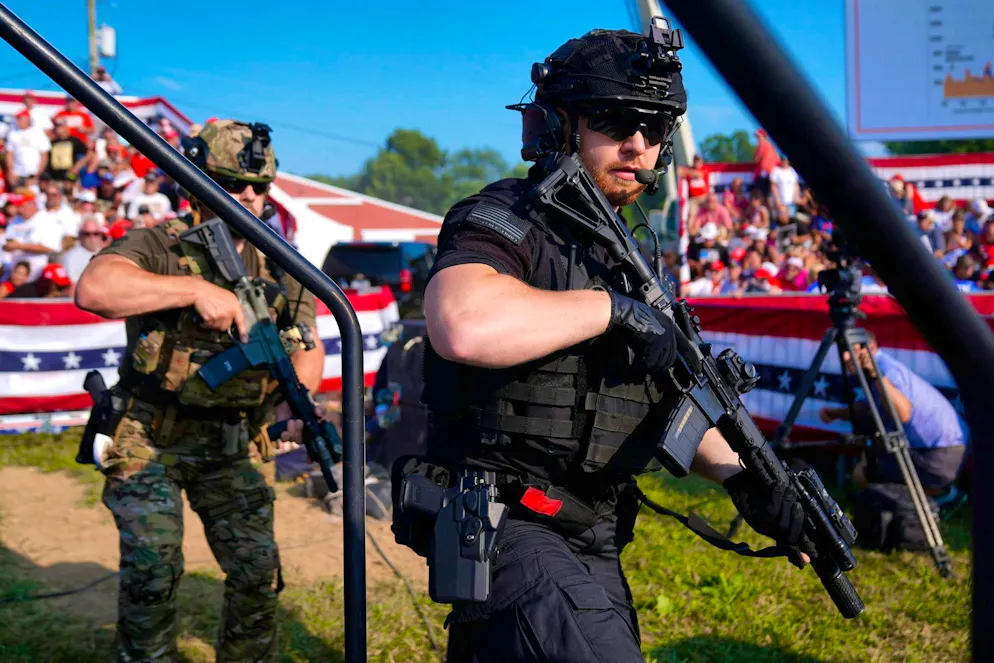 US Secret Service agents secure a stage during the campaign event.