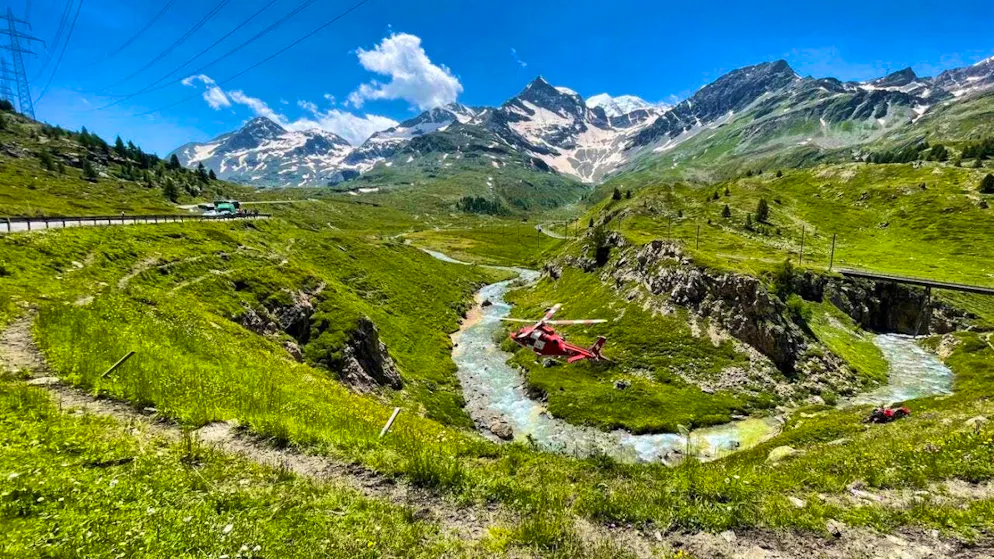 A Rega helicopter flew into the ravine and winched the injured motorcyclist out of the impassable terrain.