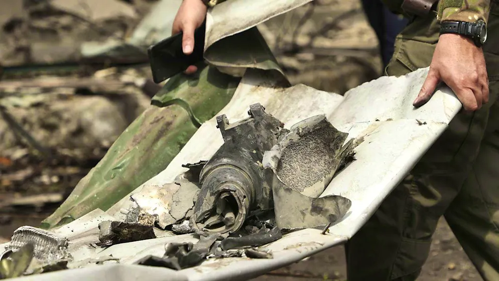 A Ukrainian soldier with debris from a Russian missile that hit a children's hospital in Kiev on July 8. (archive picture)