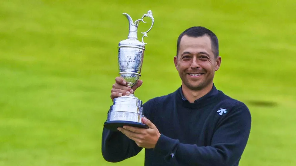 Xander Schauffele poses with the silver winner's jug