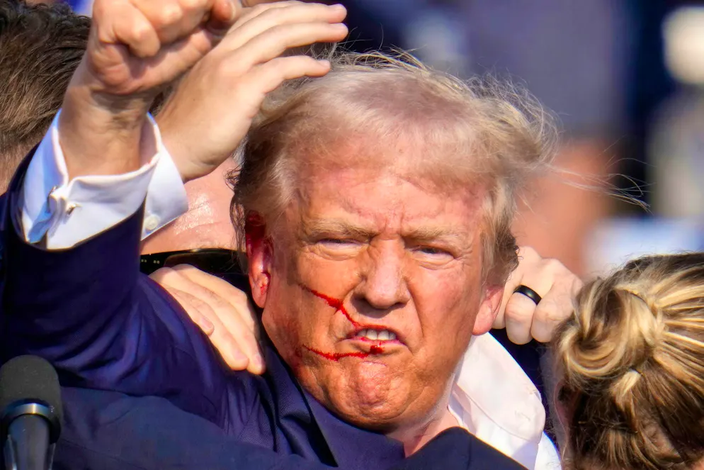Trump raises his fist covered in blood - a turning point?