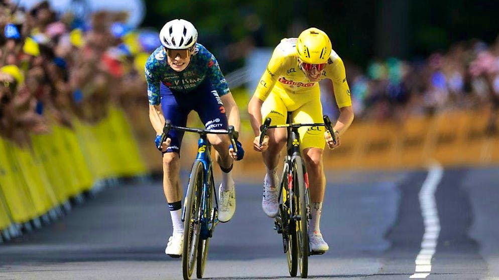 Jonas Vingegaard and Tadej Pogacar in yellow set off in a sprint at the end of a mountain stage in which they broke the record.