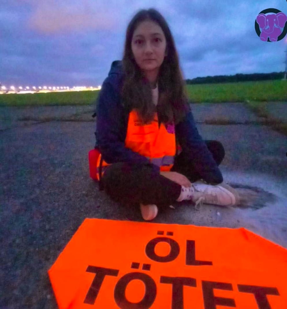 An activist from the Last Generation group taped herself to the tarmac at Cologne/Bonn Airport on Wednesday.