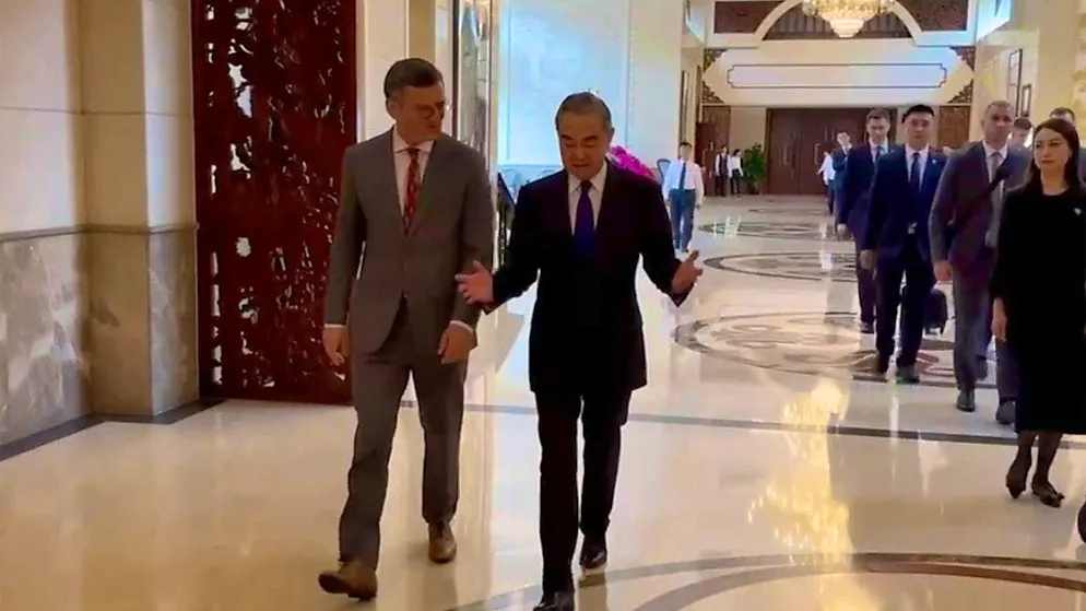 HANDOUT - In this image taken from a video released by Ukraine's Ministry of Foreign Affairs, Ukrainian Foreign Minister Dmytro Kuleba (l) walks next to Chinese Foreign Minister Wang Yi before a meeting in the southern Chinese city of Guangzhou. Photo: Uncredited/Ukraine Ministry of Foreign Affairs/AP - ATTENTION: For editorial use only and only with full attribution of the above credit