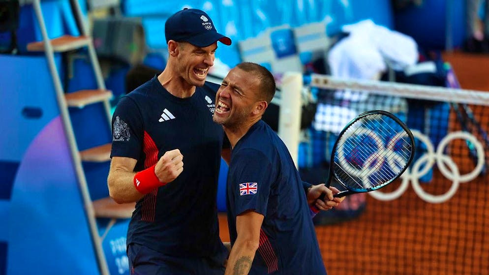 Andy Murray (left) and his doubles partner Daniel Evans are delighted after the happy ending in round 1
