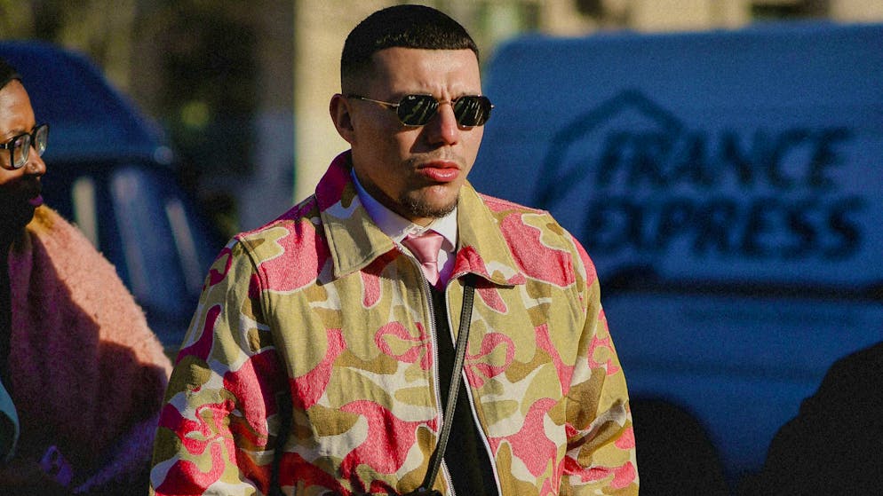 Hopefully not on his way to the Caribbean: man with a colorful camouflage jacket.