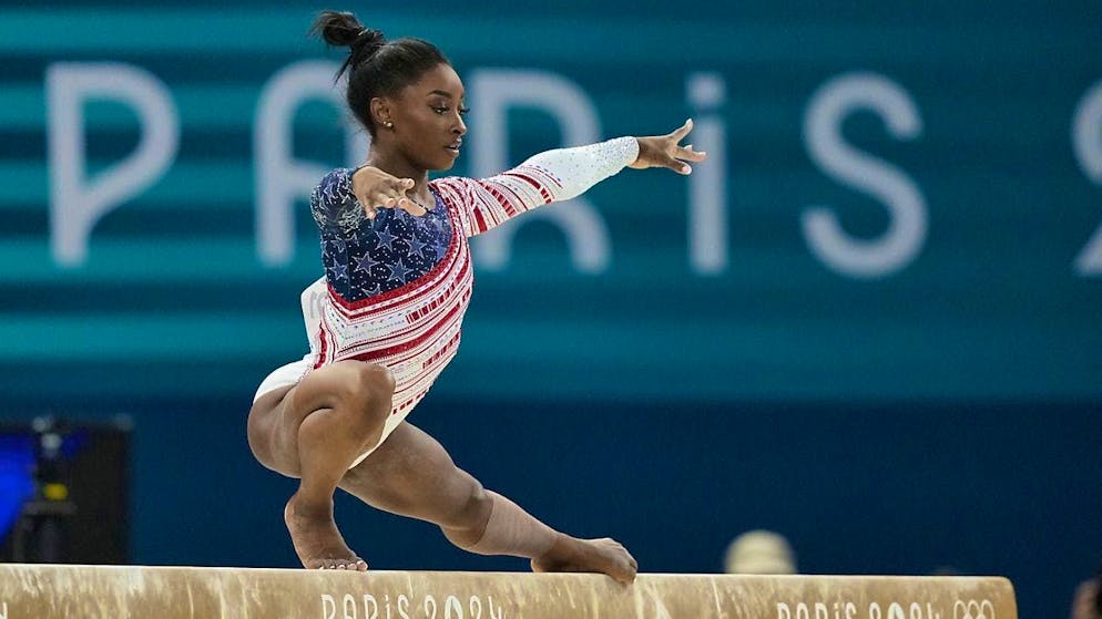 Superstar Simone Biles leads the USA to an unchallenged victory in the women's artistic gymnastics team final.