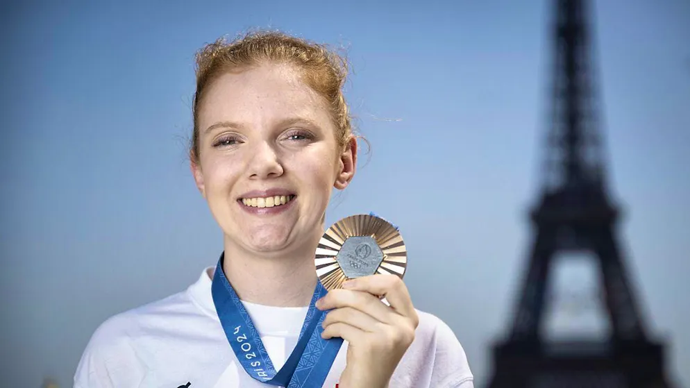 Audrey Gogniat overwhelmed by emotion at medal ceremony - Gallery. Audrey Gogniat poses with the bronze medal