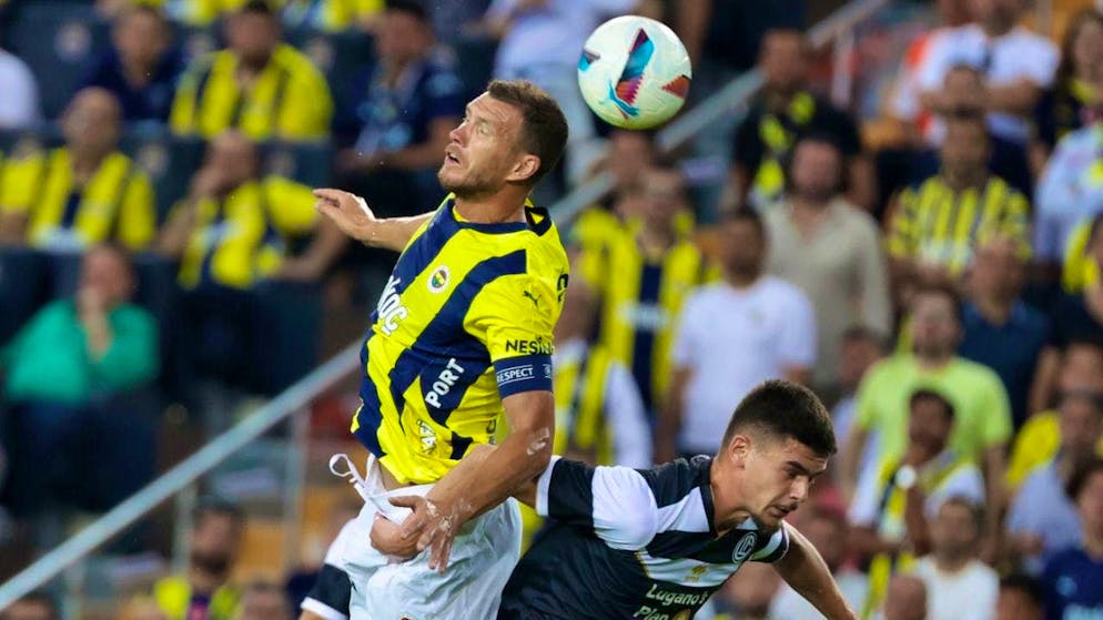 Edin Dzeko (left) scored again against Lugano