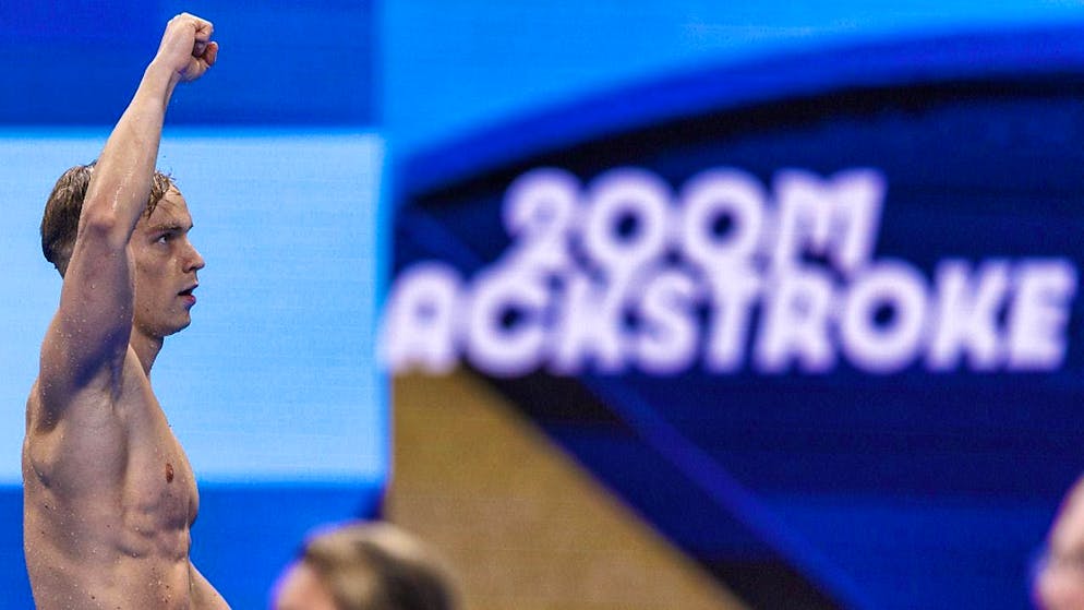 Roman Mityukov clenches his fist after his commanding performance in the 200 m backstroke preliminaries