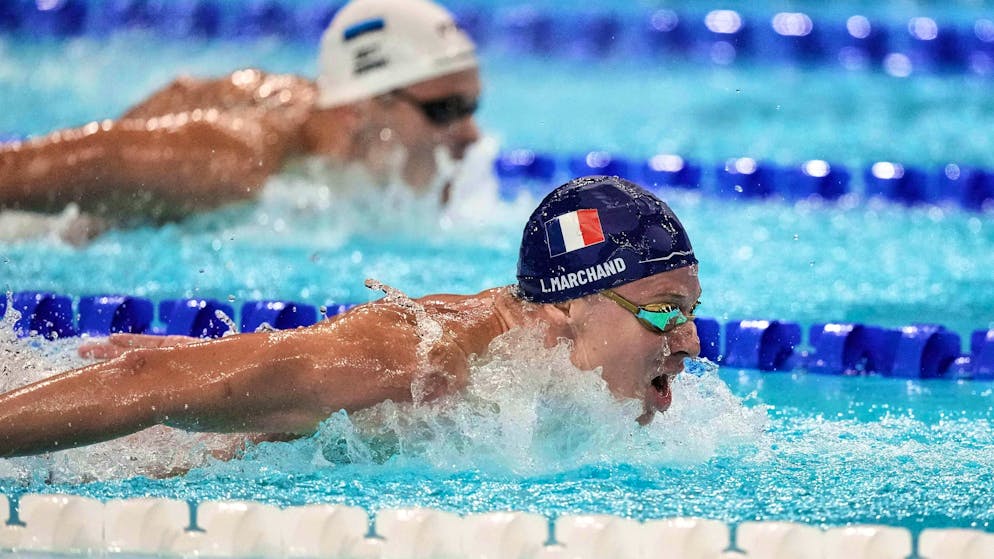 Local hero Léon Marchand swims after his own records in Paris.