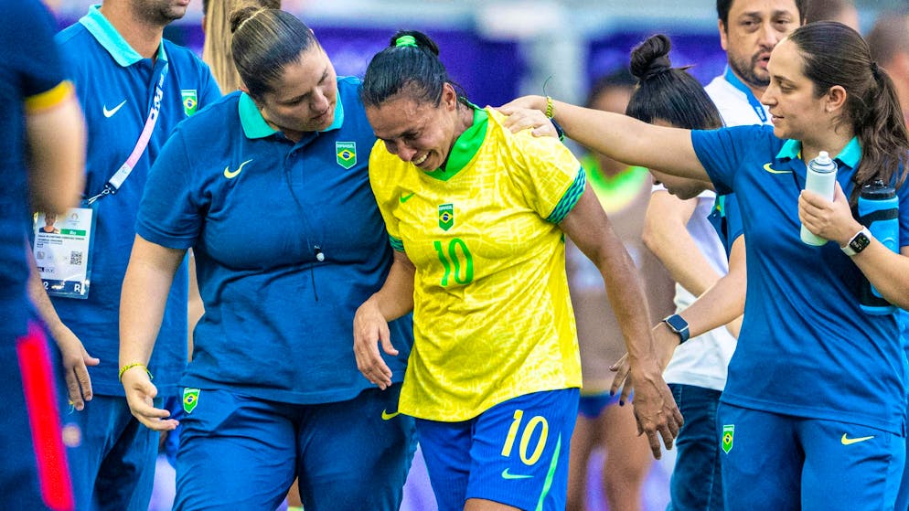 Marta sheds tears after being sent off.