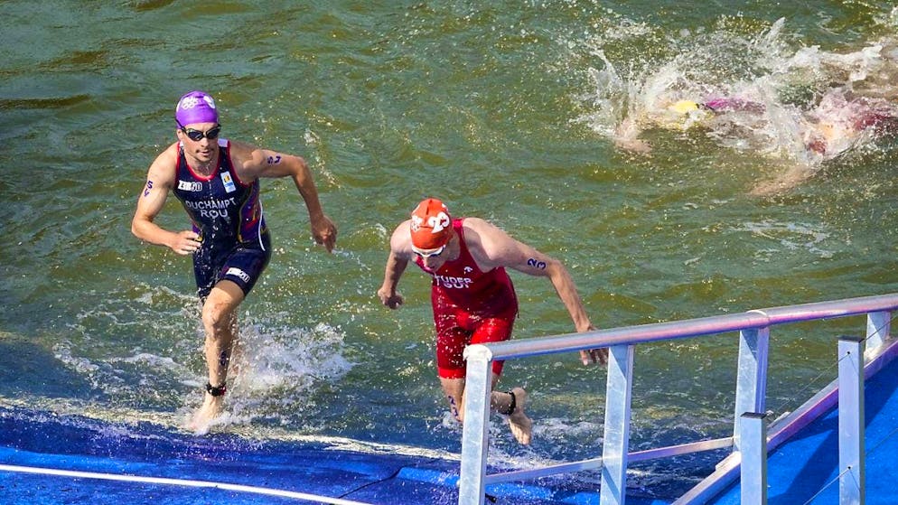 Max Studer (right) got out of the water too late in the Olympic triathlon