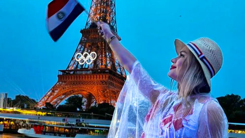 Luana Alonso (20) waves the Paraguayan flag at the opening ceremony.