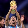 epa10373237 Guido Rodriguez of Argentina lifts the trophy after the FIFA World Cup 2022 Final between Argentina and France at Lusail stadium, Lusail, Qatar, 18 December 2022. EPA/Friedemann Vogel