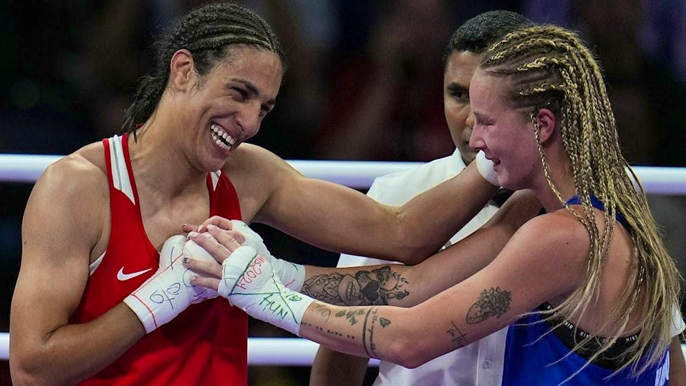 Imane Khelif (left) and the defeated Hungarian Anna Hamori embrace after the fight
