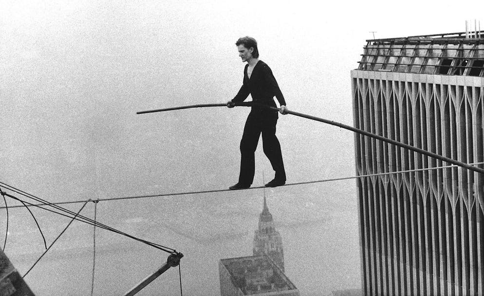 FILE - In this Aug. 7, 1974 file photo, Philippe Petit, a French high wire artist, walks across a tightrope suspended between the World Trade Center's Twin Towers in New York. Philippe Petit stars in "Man on a Wire," directed by James Marsh. (AP Photo/Alan Welner, File)