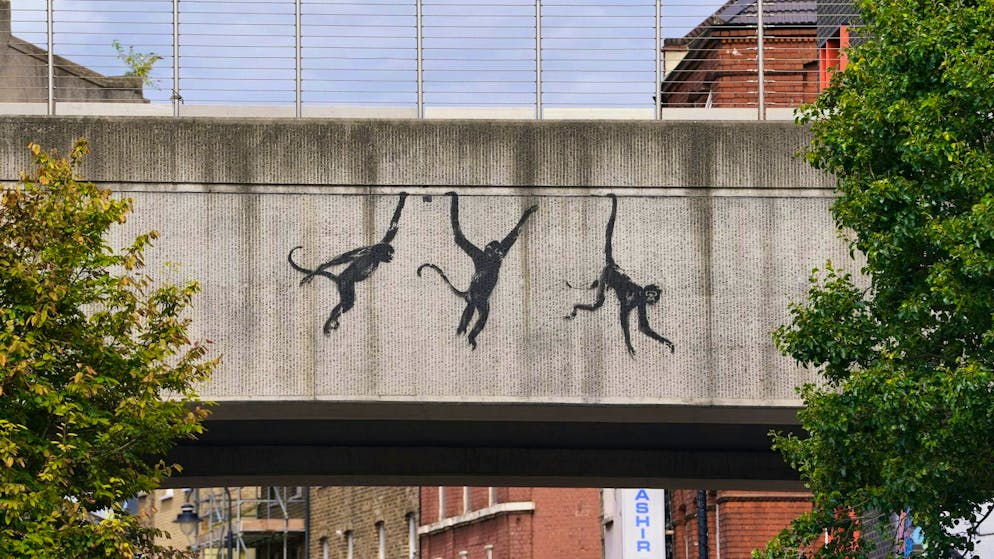 Cat stretching: Banksy continues series of paintings in London - Gallery. The three monkeys brought a Japanese proverb to mind.