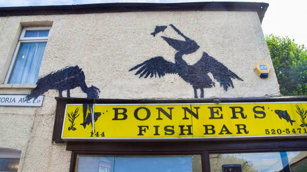 Cat stretching: Banksy continues series of paintings in London - Gallery. The pelicans at a fish and chip store appeared on a Friday - when many Britons indulge in the traditional meal.