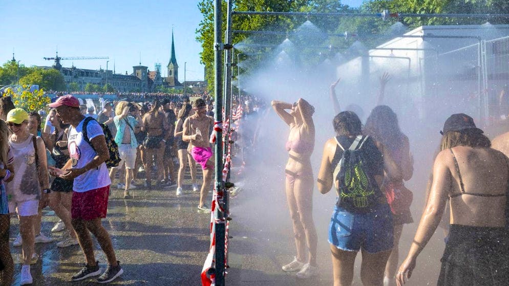 Shower lanes at the edge of the route provided ravers with much-needed cooling.