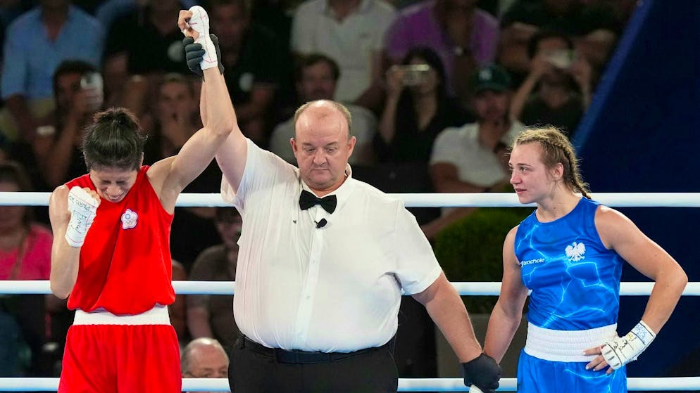 Lin Yi-ting from Taiwan (l) wins Olympic gold in boxing.