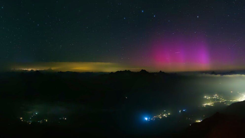Weather lights. Northern Lights and shooting stars in the Swiss night sky