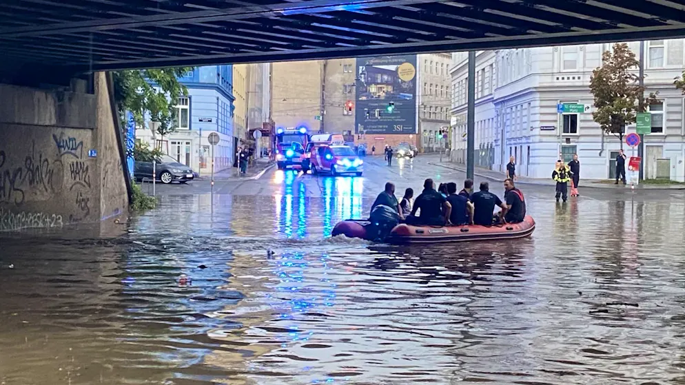 Flooding in Austria. Record rain floods parts of Vienna - woman washed under bus
