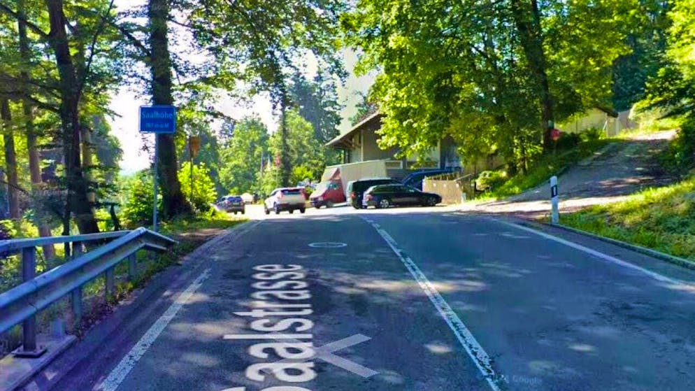 The skateboarder was traveling downhill on this road with a companion.