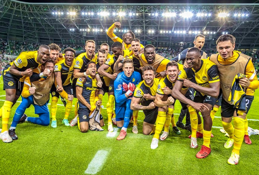The YB players celebrate reaching the group stage of the Champions League.