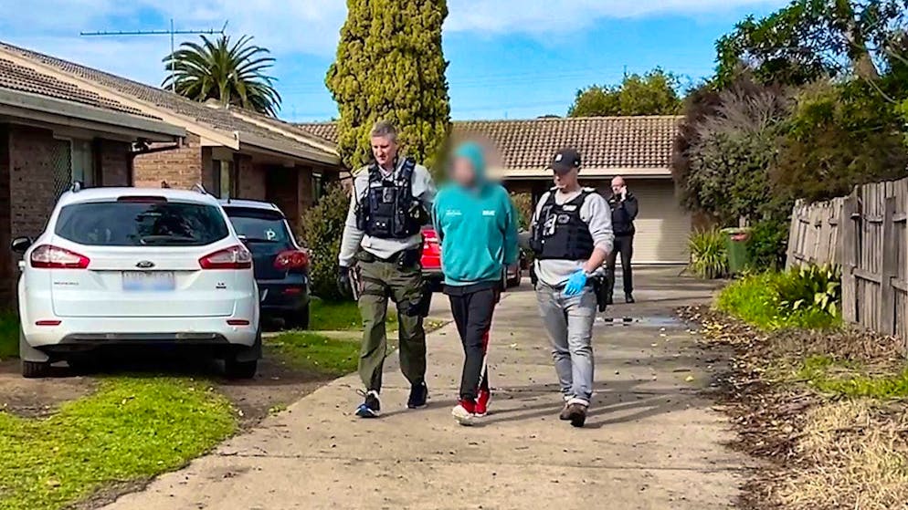 HANDOUT - A 37-year-old man is arrested by police in Bendigo as part of Operation Vitreus. Photo: VICTORIA POLICE/dpa - ATTENTION: For editorial use only and only with full attribution of the above credit