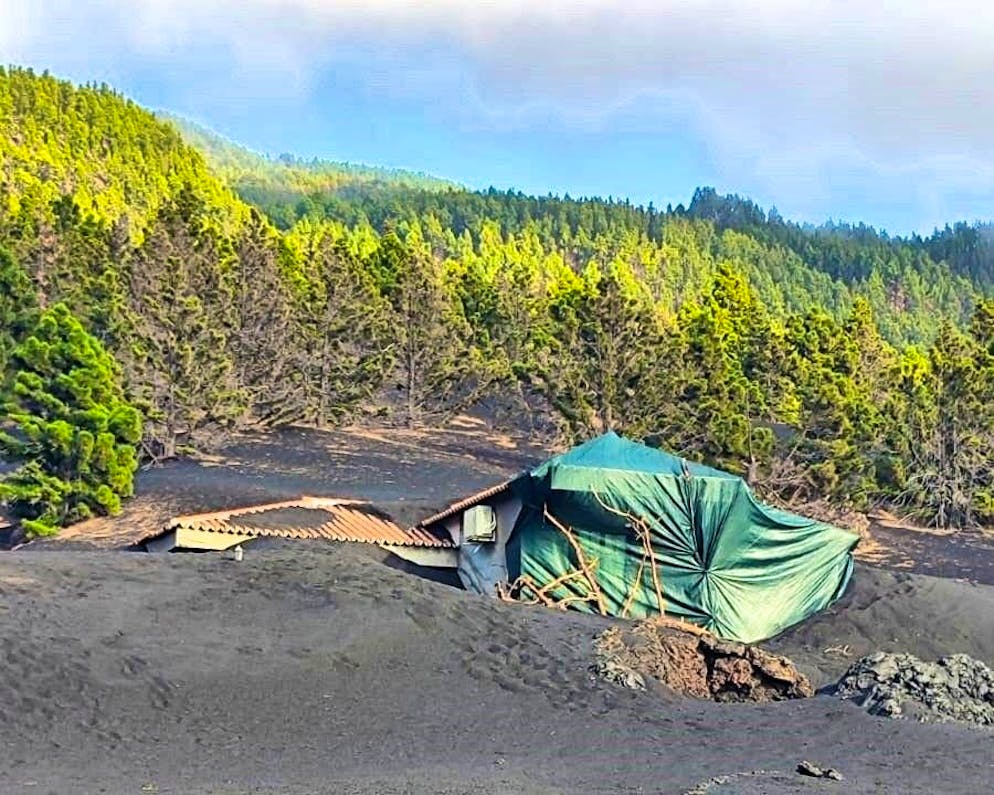 The house is now covered with a tarpaulin 
