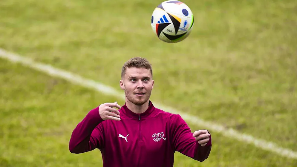 Nico Elvedi defends against Denmark alongside Ricardo Rodriguez and Manuel Akanji