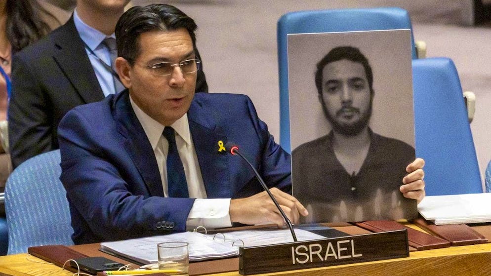 Danny Danon, Israeli Ambassador to the United Nations, with the yellow lapel pin and a picture of hostage Hersh Goldberg-Polin, who was killed in the Gaza Strip. (September 4, 2024)