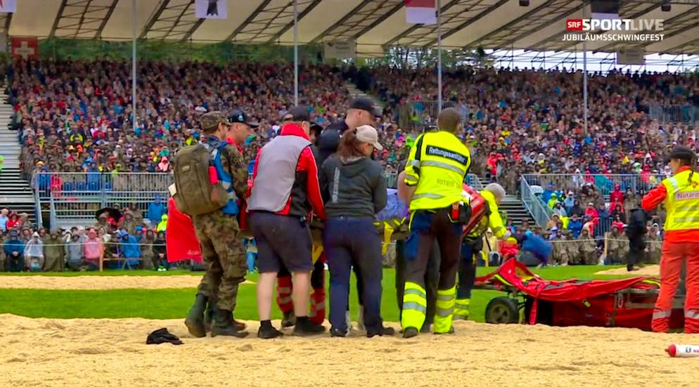 Sven Schurtenberger has to be carried off the course.