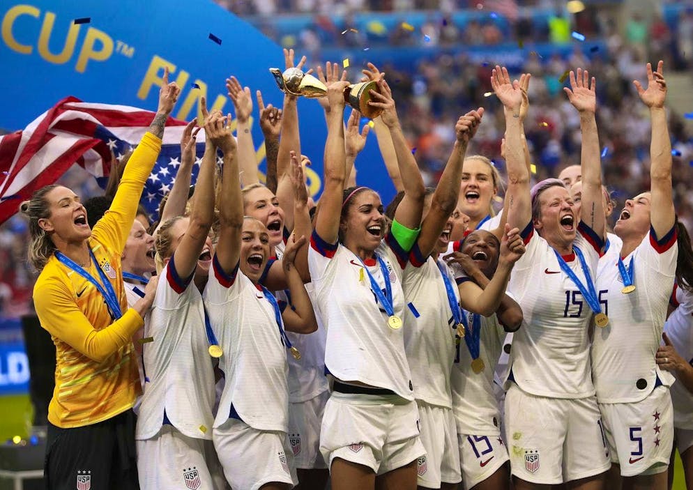Alex Morgan (with trophy) leads the US team to the 2019 World Cup title.