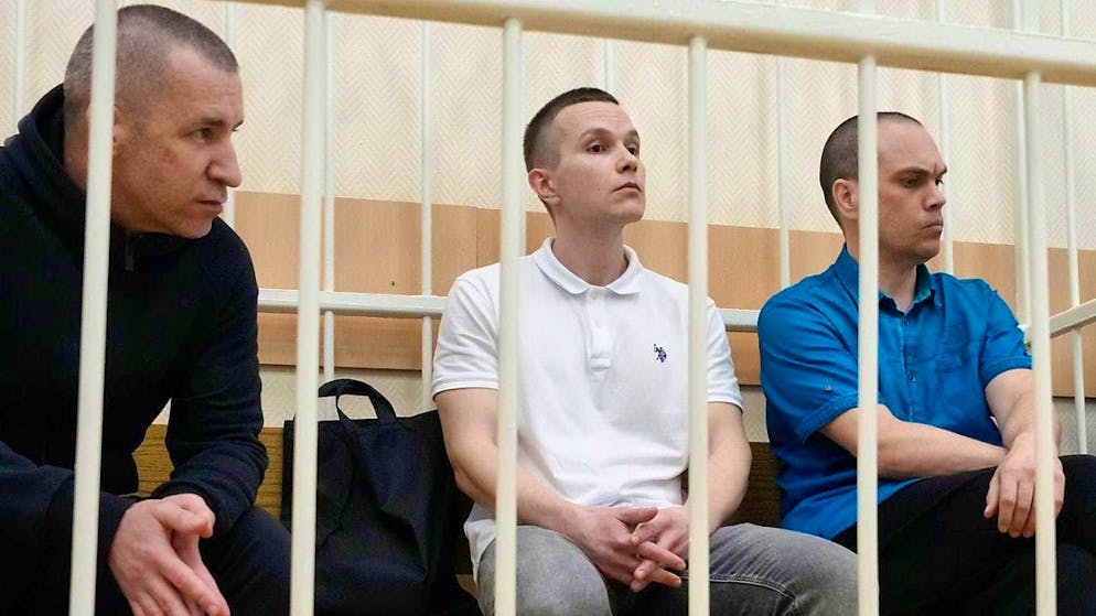 The former lawyers of Kremlin critic Alexei Navalny, Igor Sergunin (l-r), Alexei Liptser and Vadim Kobtsev, during the trial. Photo: Alexander Zemlianichenko/AP