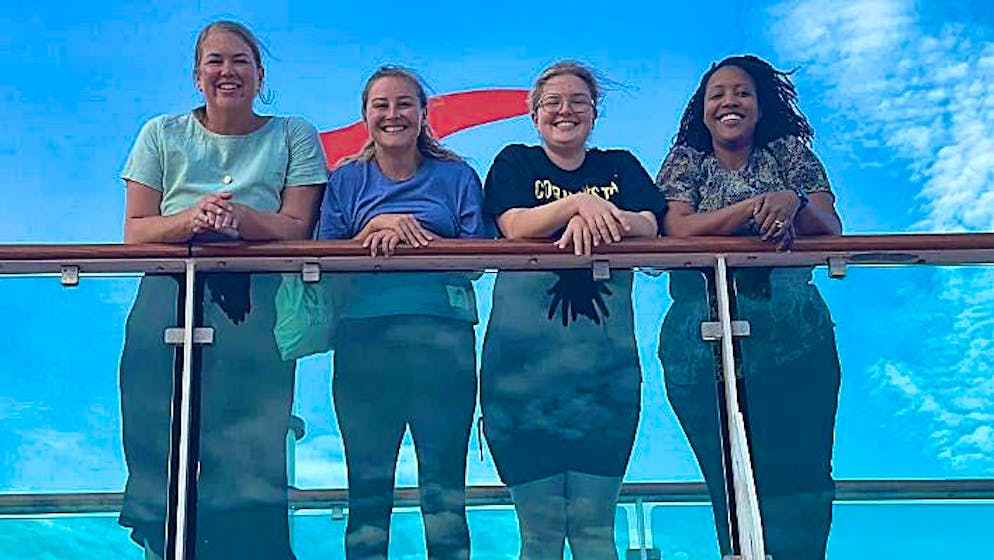 Four passengers on the "Serenade of the Seas", including Angie Linderman (left) and Little Rat Brain (second from right).