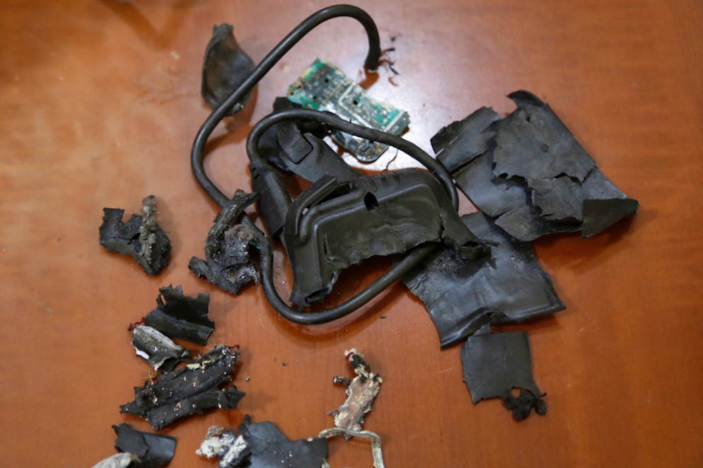 A photo taken on September 18, 2024, in Beirut's southern suburbs shows the remains of exploded pagers on display at an undisclosed location. - Hundreds of pagers used by Hezbollah members exploded across Lebanon on September 17, killing at least nine people and wounding around 2,800 in blasts the Iran-backed militant group blamed on Israel. (Photo by AFP)