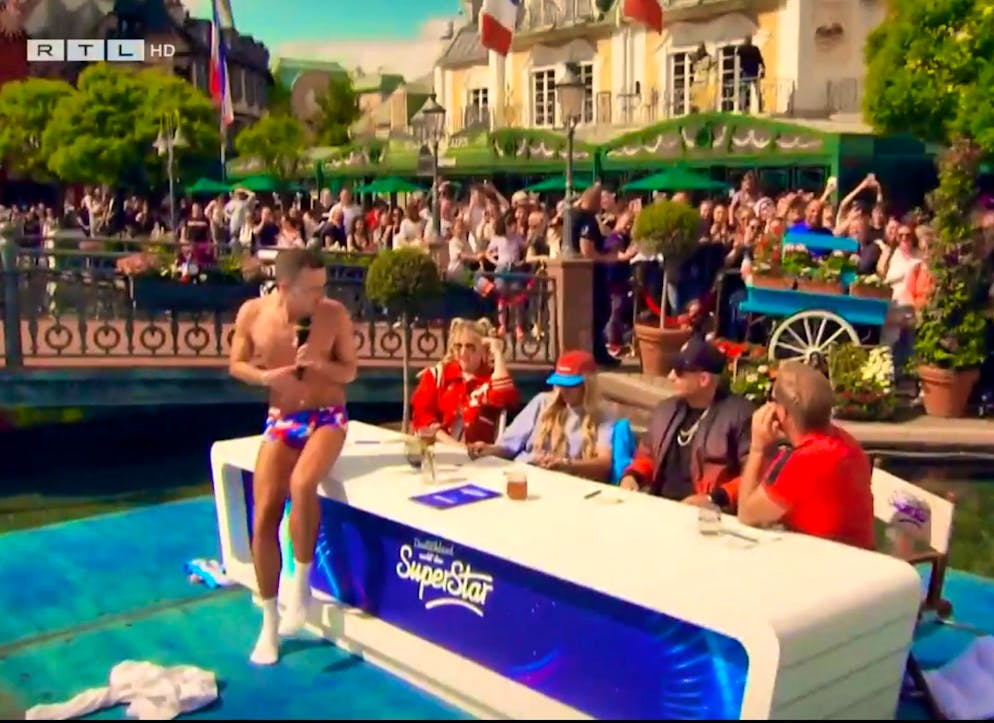 Oiled up on the jury panel: the stripping psychic singer caused horror among the jury.