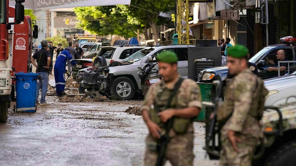 Lebanese soldiers stand guard near the site of the Israeli attack in a southern suburb of Beirut. Photo: Bilal Hussein/AP