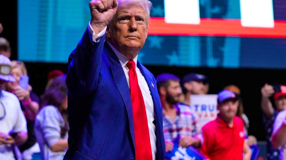 Republican US presidential candidate and former US President Donald Trump stands on stage at the Johnny Mercer Theatre Civic Center on the topic of tax legislation and manufacturing. Photo: Evan Vucci/AP