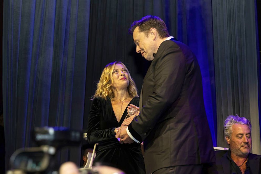 Elon Musk, CEO of Tesla, right, presents Giorgia Meloni, Italy's president of the Council of Ministers, with an award during the Global Citizen Awards dinner, Monday, Sept. 23, 2024, in New York. (AP Photo/Michelle Farsi)