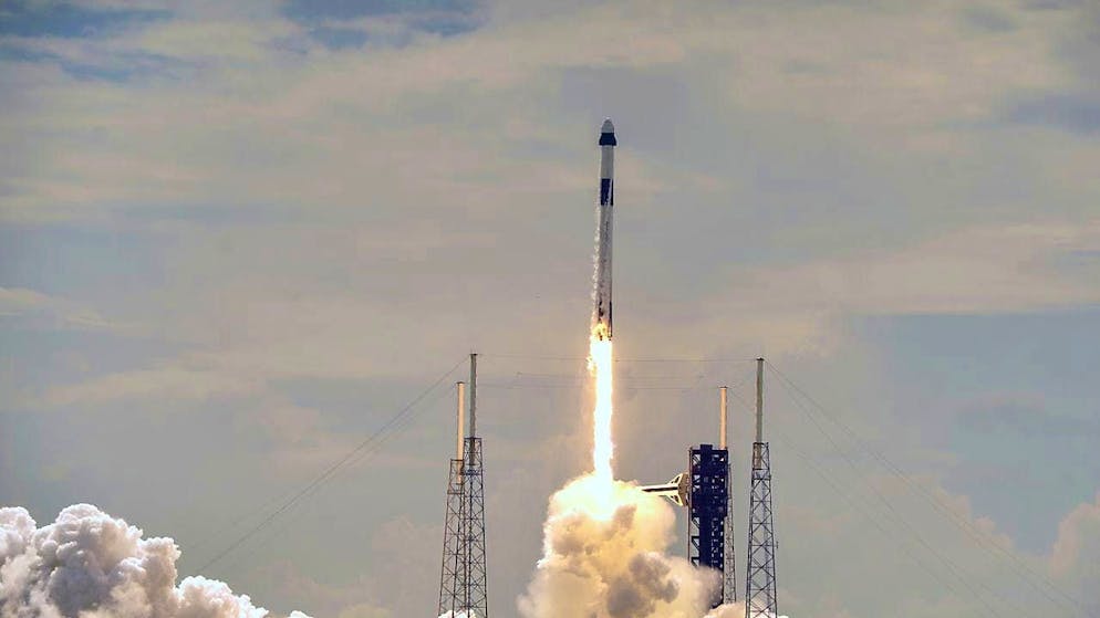 A SpaceX Falcon 9 rocket with a crew of two lifts off from the launch pad in Cape Canaveral, Florida, on Saturday.