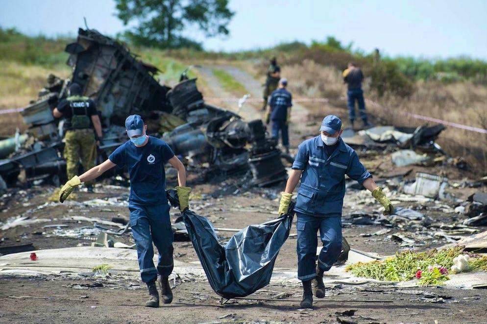 Rescuers recover bodies from flight MH-17 in Hrabowe in eastern Ukraine on July 17, 2014.
