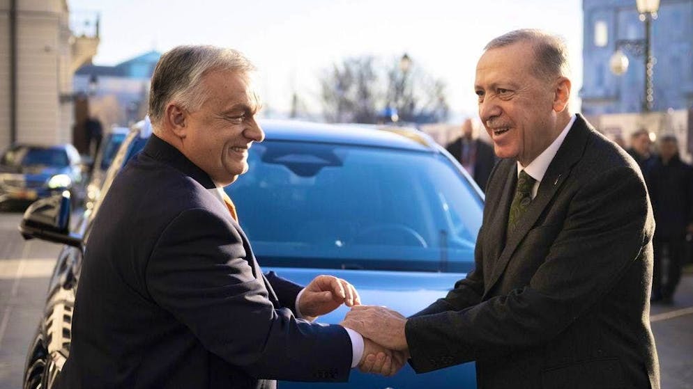 Viktor Orban (left) shakes hands with Recep Tayyip Erdogan in Budapest on December 18, 2023.
