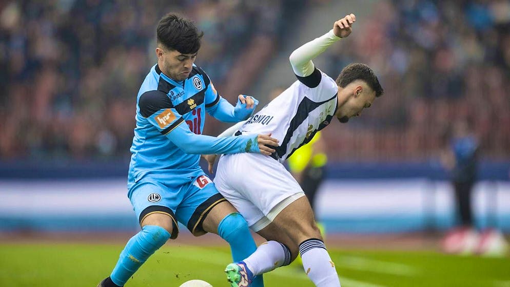 Lugano's Ignacio Aliseda in a duel with Zurich's Bledian Krasniqi