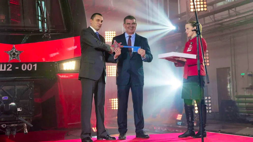 Aeroexpress General Director Alexei Krivoruchko, left, receives the symbolic key for the first "Aeroexpress" double-decker train from Stadler CEO Peter Spuhler in Moscow on November 13, 2014.