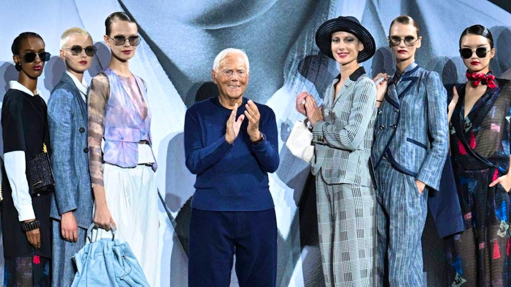 Designer Giorgio Armani greets the audience at the end of a fashion presentation in Milan in September. (archive picture)